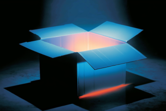 An unmarked shipping box cut open to reveal machined metal, representing an anonymous model release