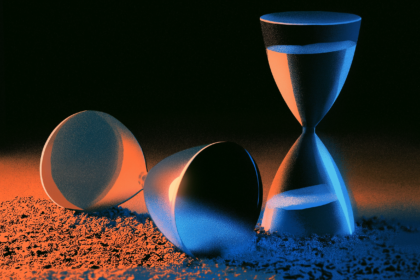 Two hourglasses, one upright and running and one lying spent, illustrating a limit removed and then restored