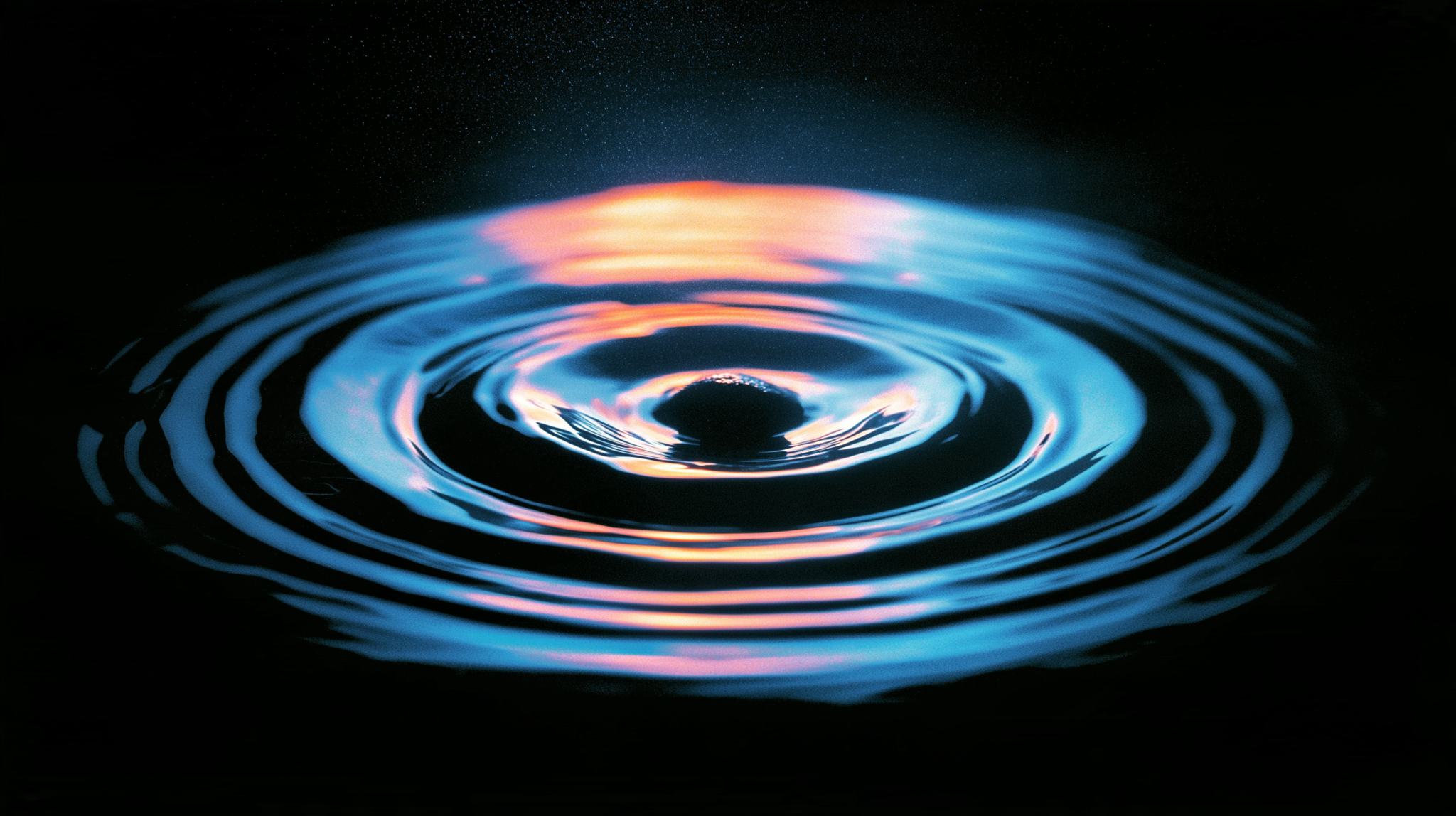 Ripples spreading from a single point, representing a claim travelling outward through repetition