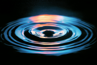 Ripples spreading from a single point, representing a claim travelling outward through repetition