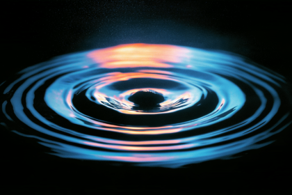 Ripples spreading from a single point, representing a claim travelling outward through repetition