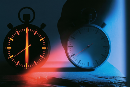 Two stopwatches showing different elapsed times, representing the same task run through different harnesses