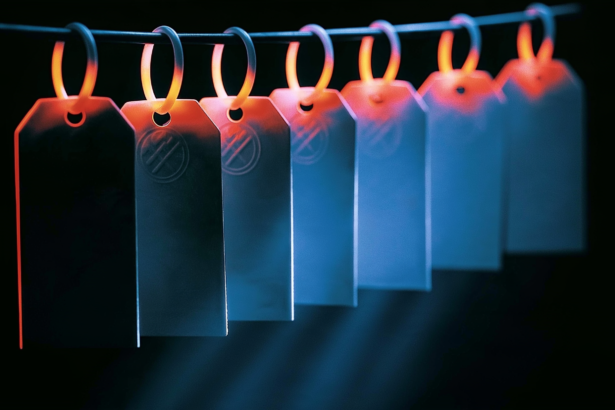 Seven hanging tags with five sharing a mark, representing five of seven repos built on one model